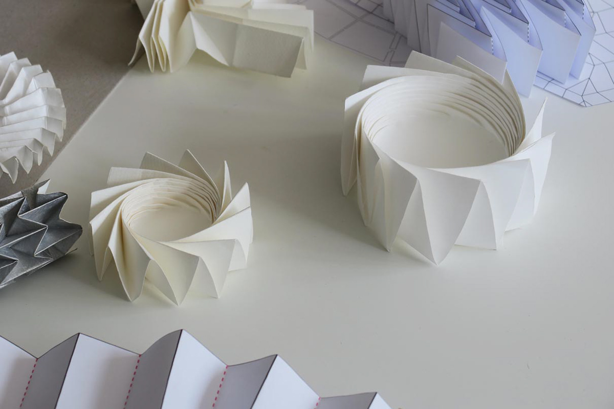 Paper models of twister folds used in aerospace.