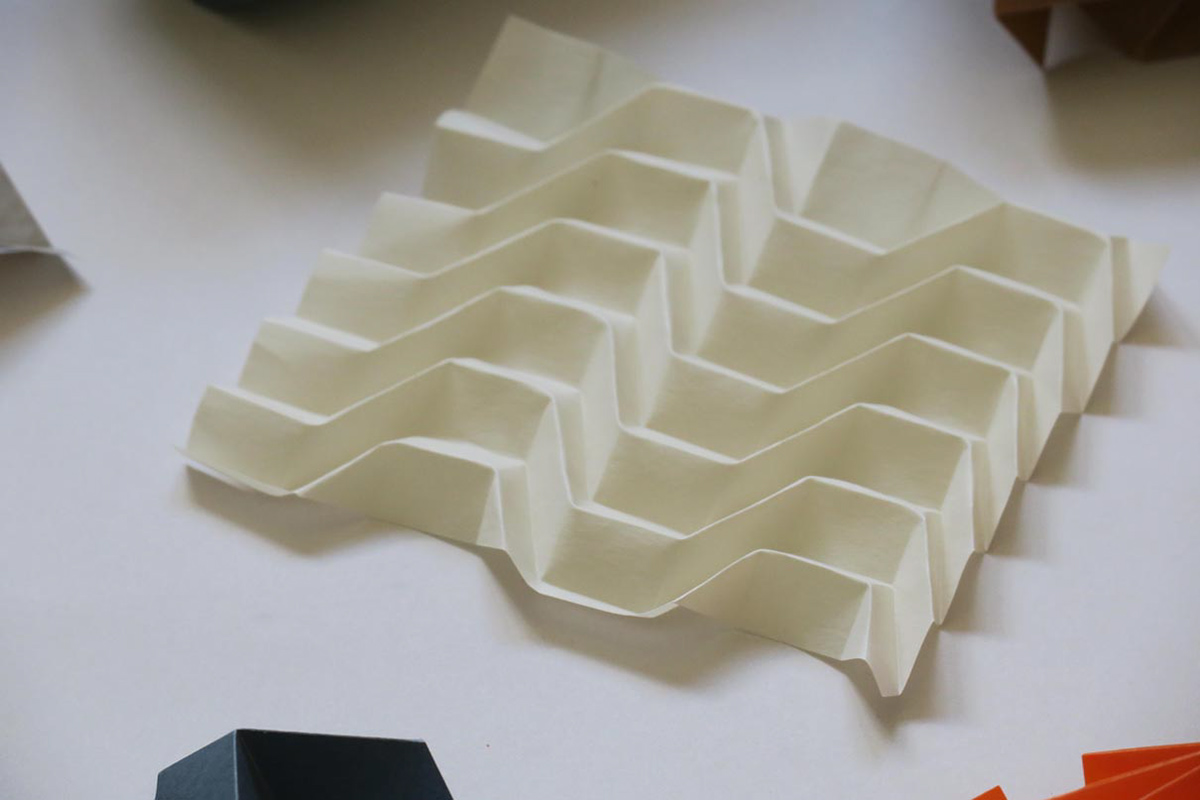 White folding structure made of vulcanic fever for the workshop on Origami Technology at Sachsenröder.