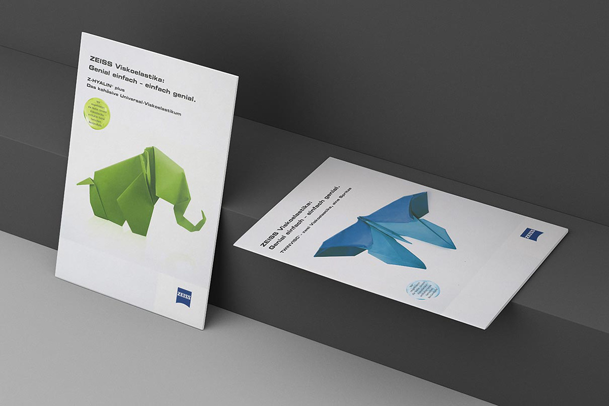 Cover illustration of brochures with images of an origami folded object such as an elephant or a butterfly.
