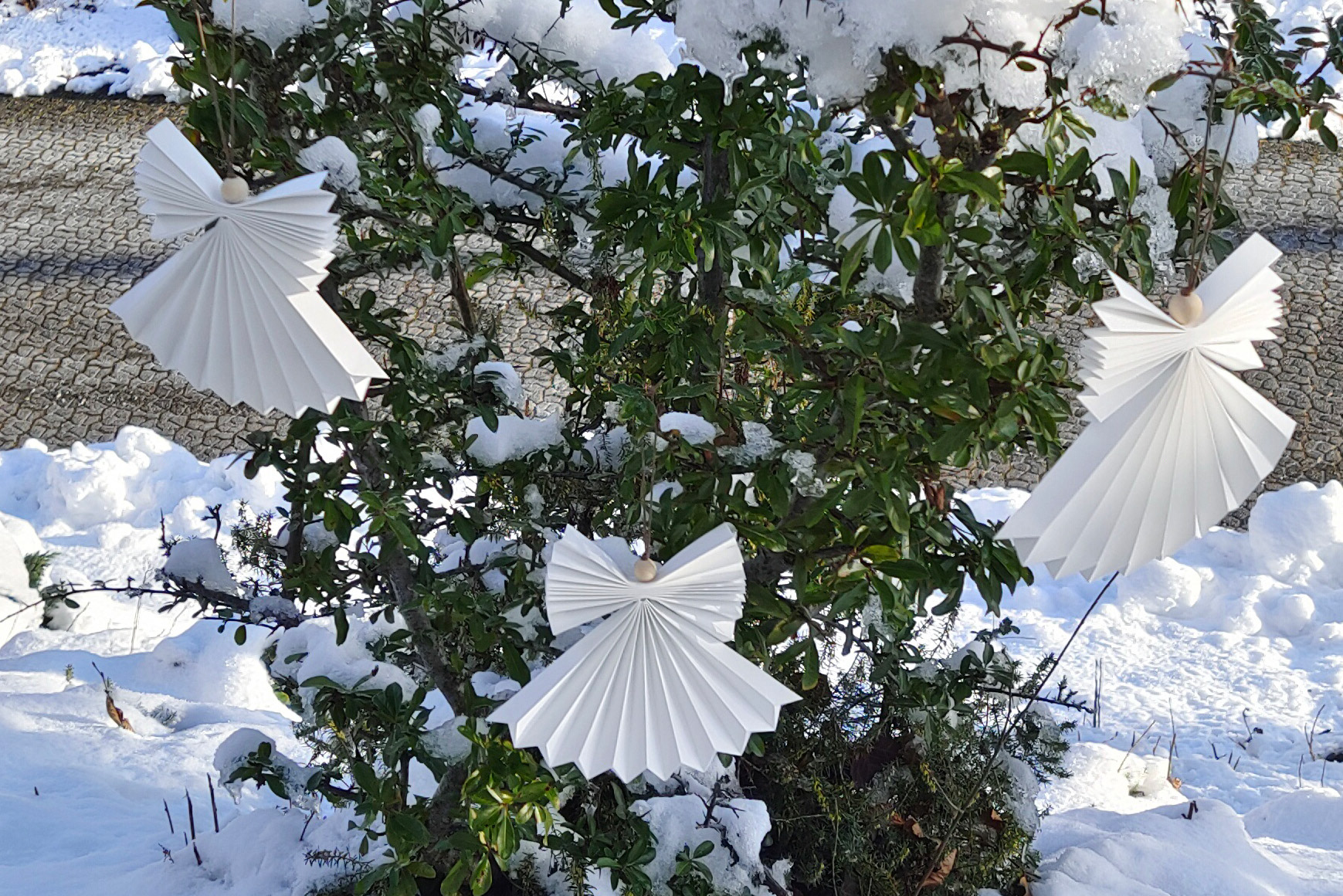 3 outdoor origami angel made handmade out of waterproof origami paper.