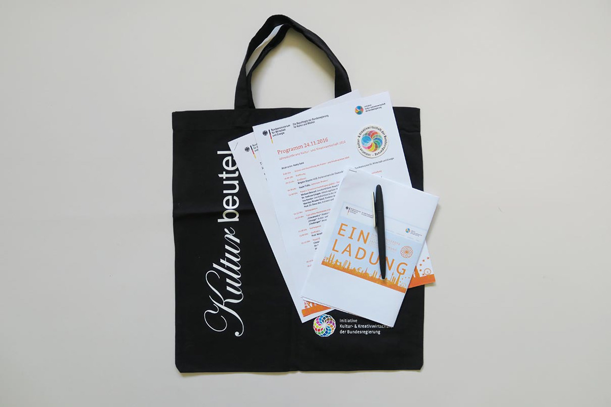 Goodie bag with the program, stickers and ballpoint pen at the Federal Government's Annual Conference on the Cultural and Creative Industries.