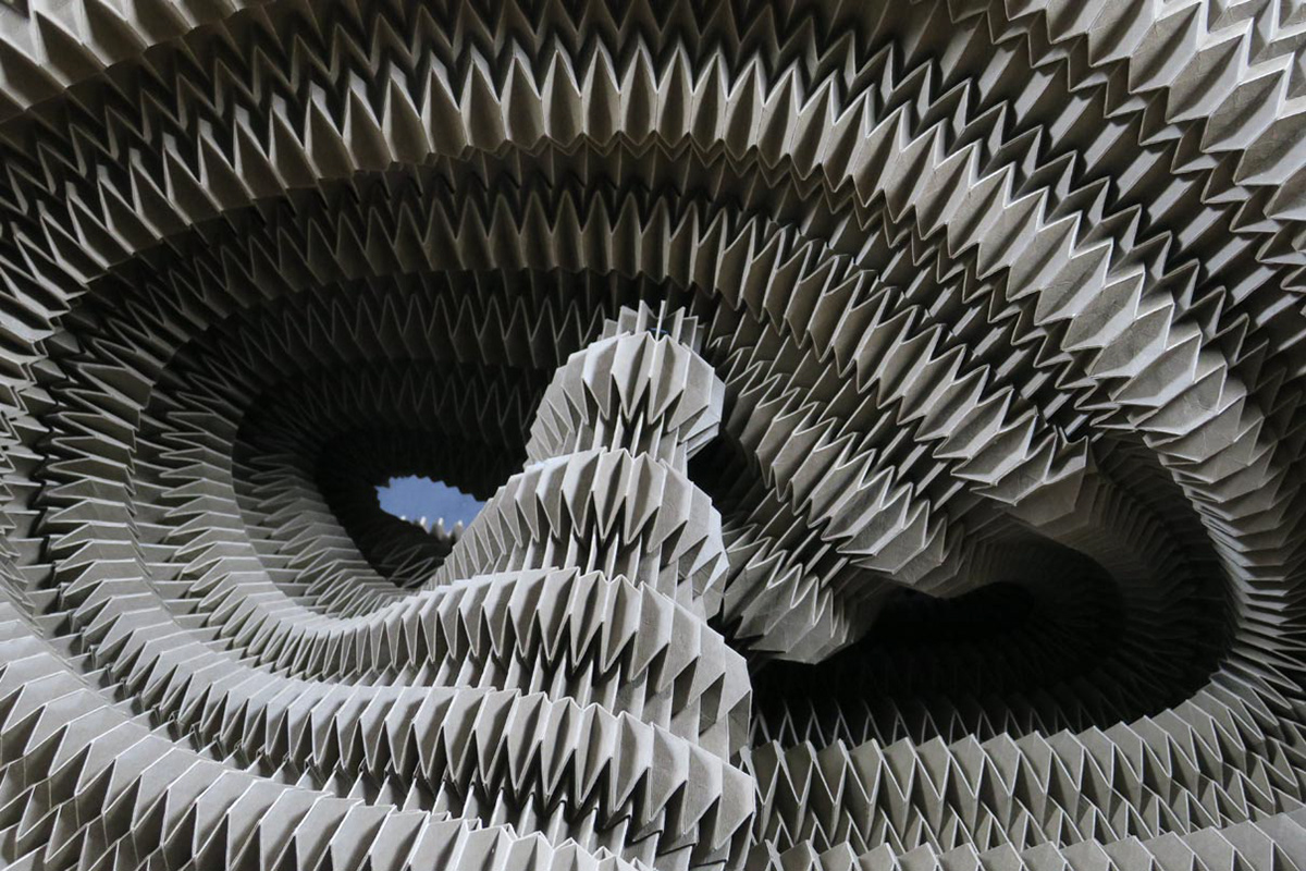 Large origami folding structure made of vegan leather for window displays and set design by Kristina Wißling.