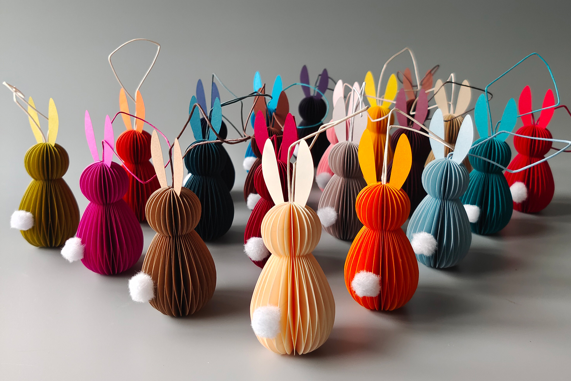 Handmade paper bunnies in many different colors, made in Germany using the honeycomb folding technique.