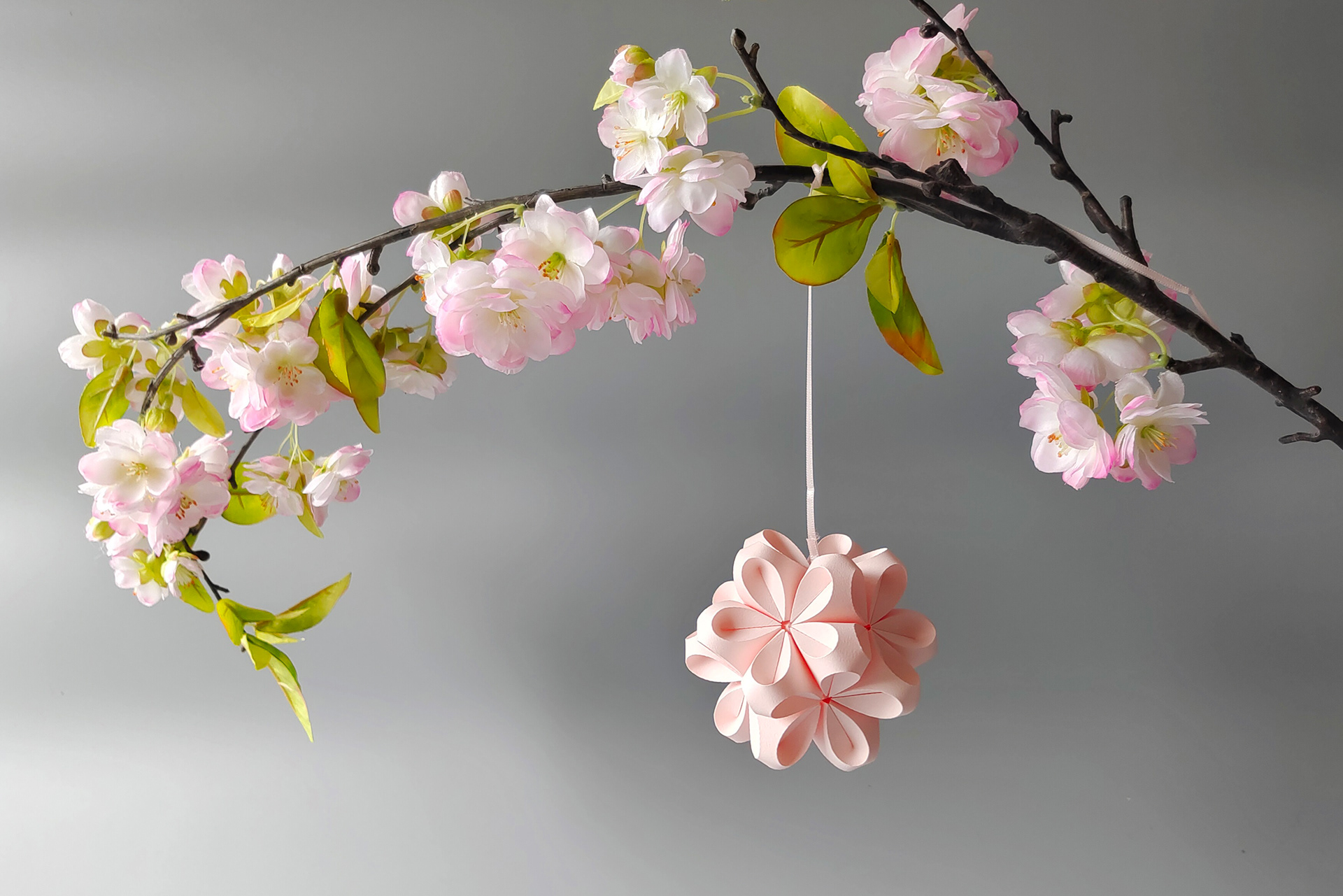 Paper blossom in rose handcrafted from japanese origami paper.