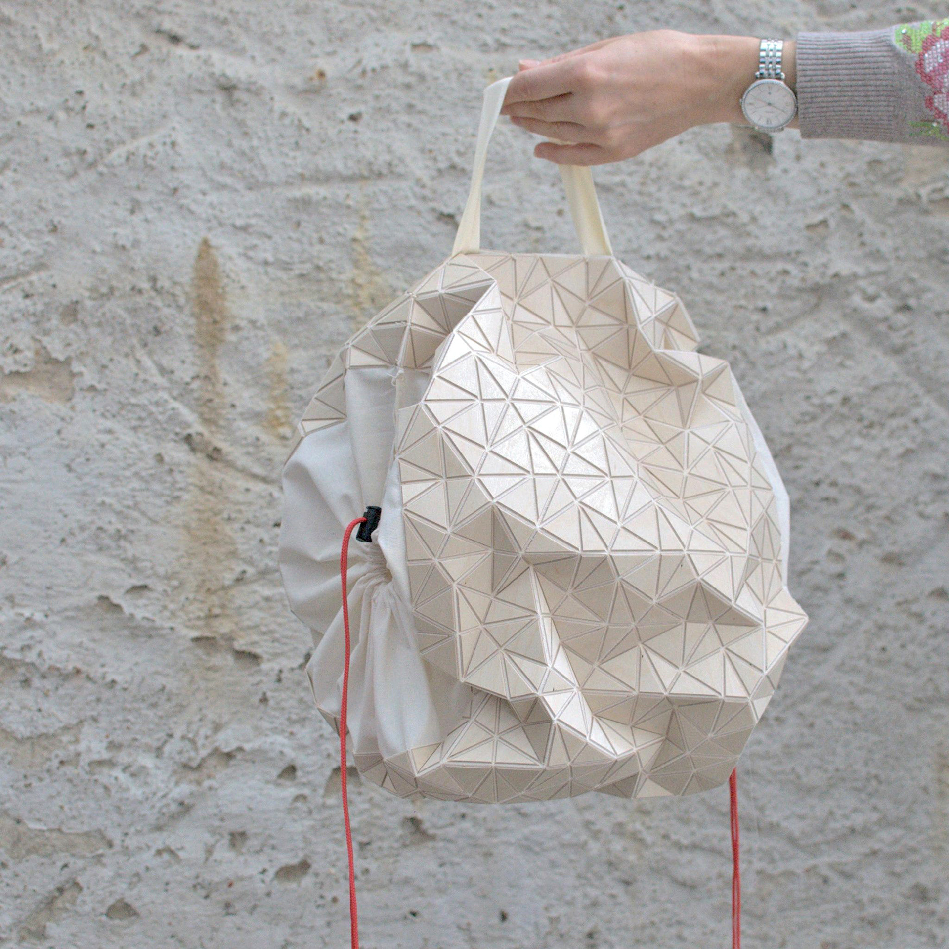 Prototype of a shoe packaging made of folded wood and textile for H&M with the DoSchool and Kristina Wißling.