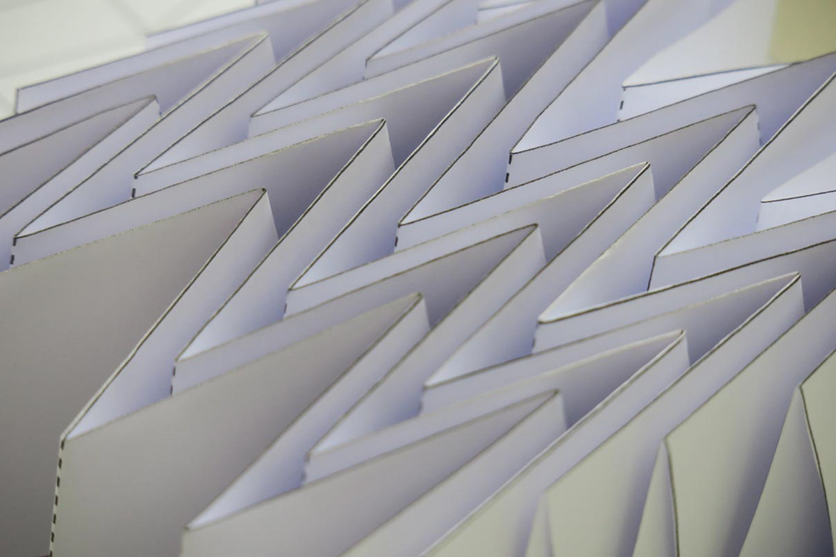 Close-up of an origami paper model using the Miura Ori folding technique.