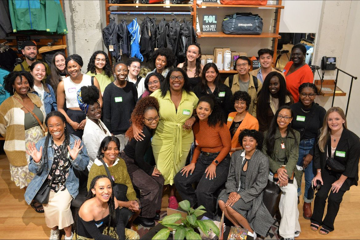 Group photo with the speakers and attendees at the Black Girl Environmentalist Happy Hour event.