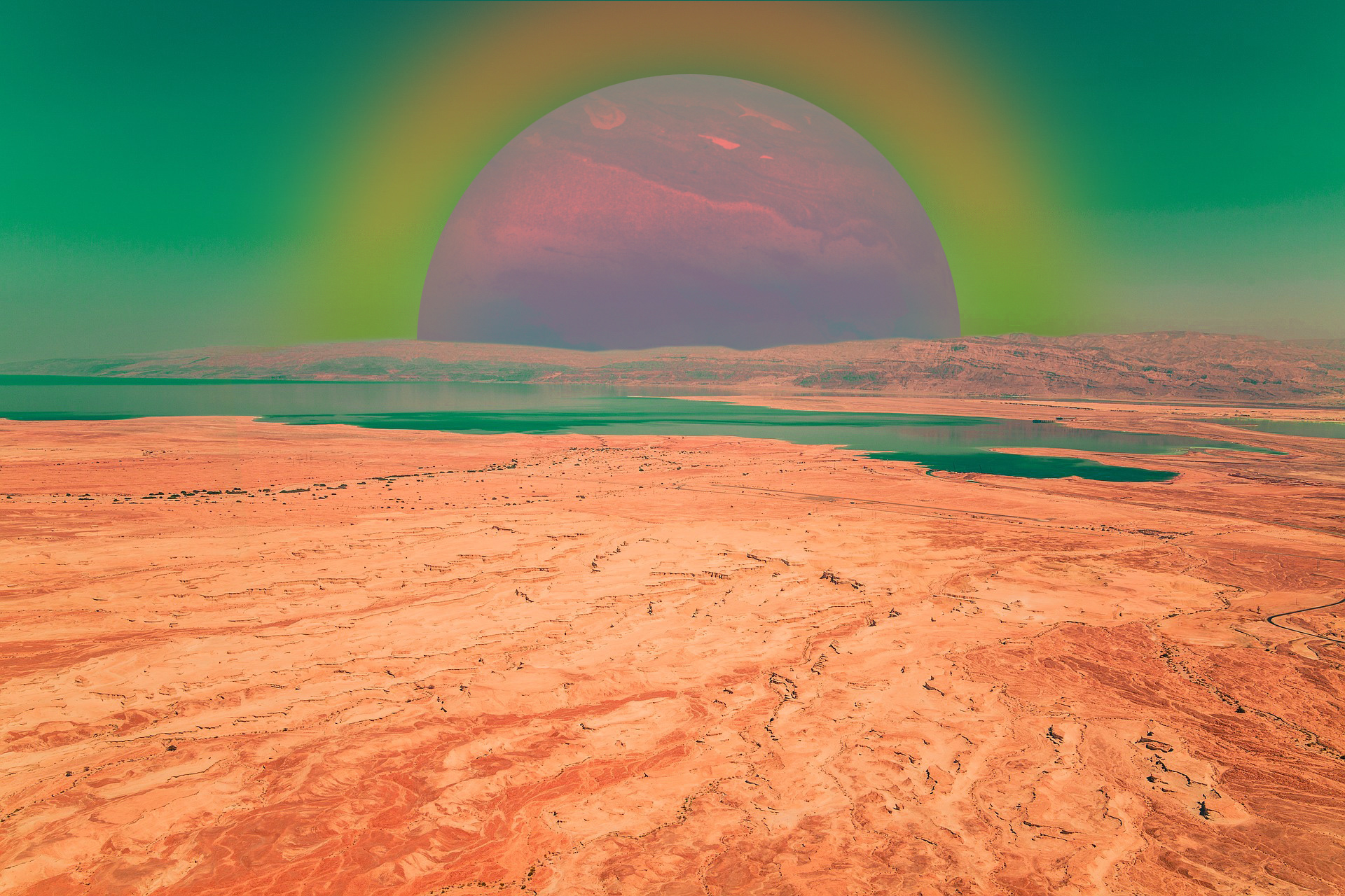 A desktop wallpaper blending a desert landscape with extra-terrestrial elements.