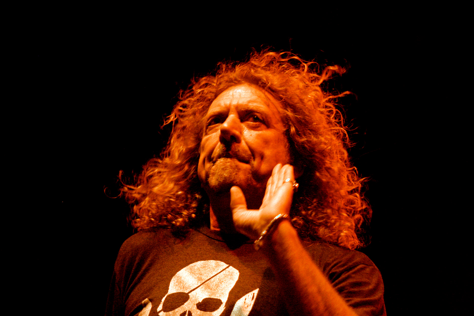 Robert Plant greeting audience after live performance in Antalya Turkey, concert stage photography with dramatic lighting