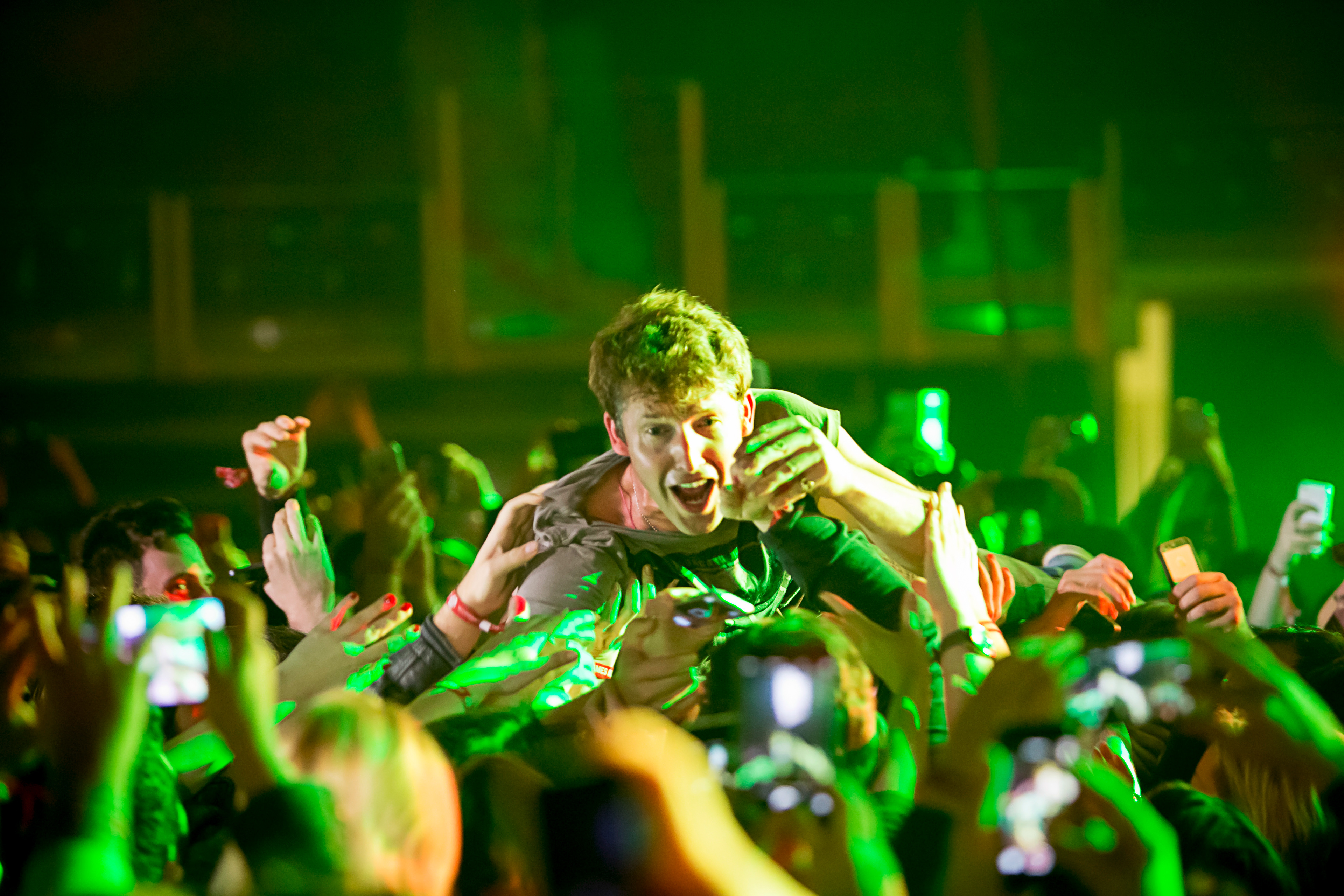 James Blunt crowd surfing during live concert at Ulker Sports Arena Istanbul, audience interaction and stage performance photography