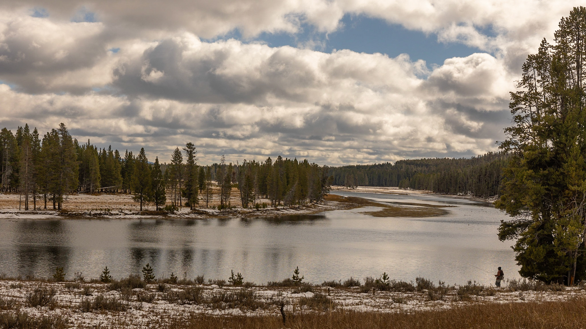 A fisherman prepares to cast into the Yellowstone river for trout. Me. Me, I'm just in awe of the vista.