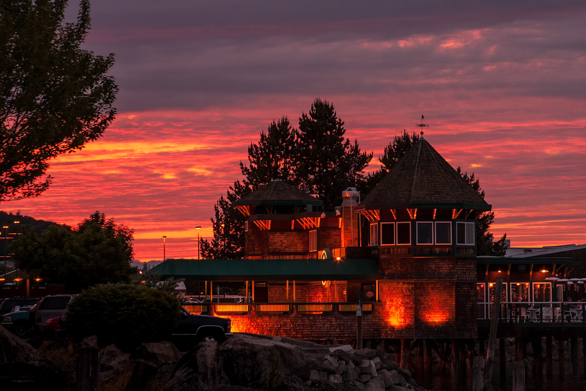 Katie Downs is  a popular tavern located on Commencement Bay in Tacoma. Lit up for the evening while the sky lights up makes for a marvelous show.