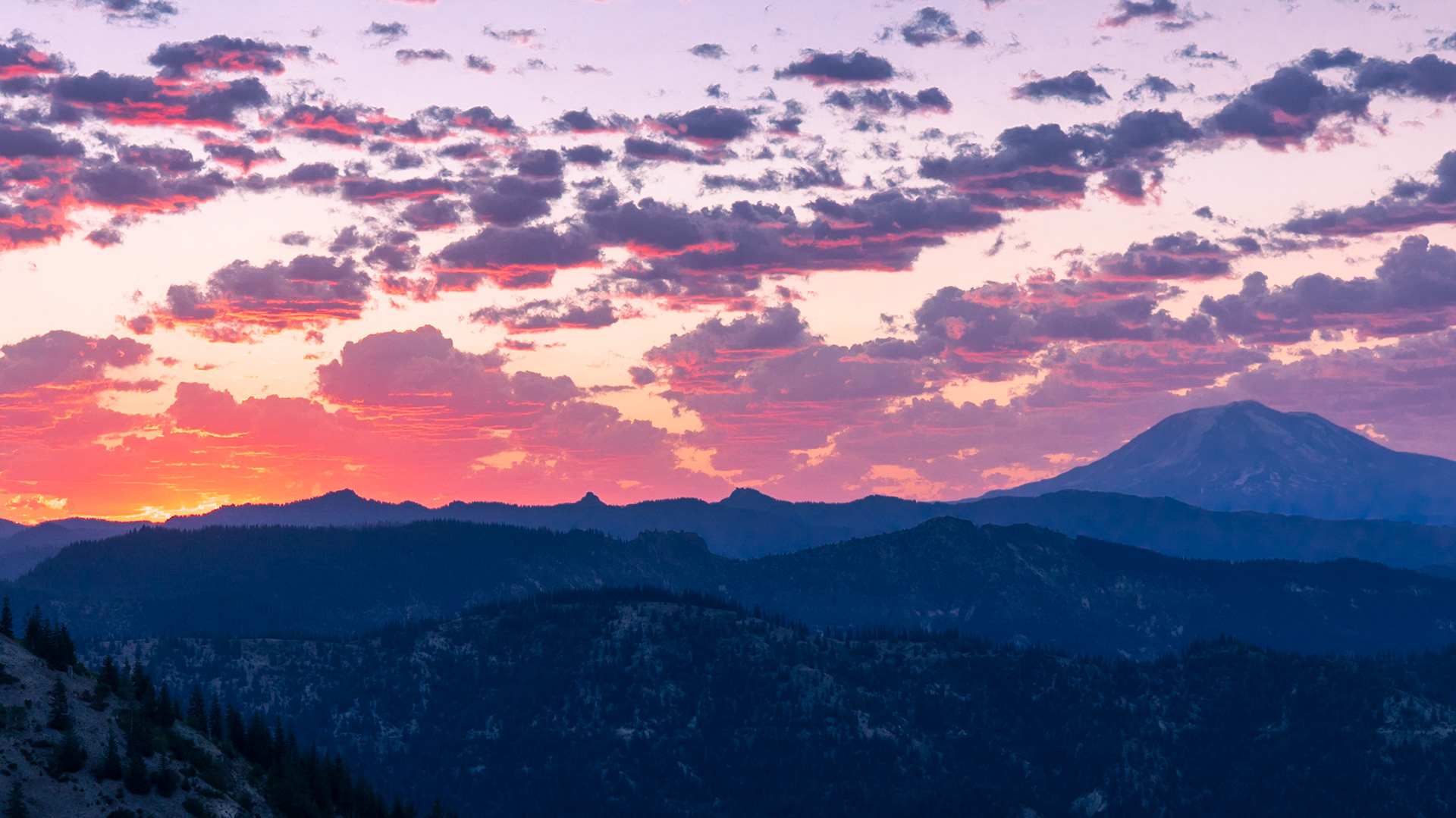 The morning sun lights up the clouds above Mt Adams.