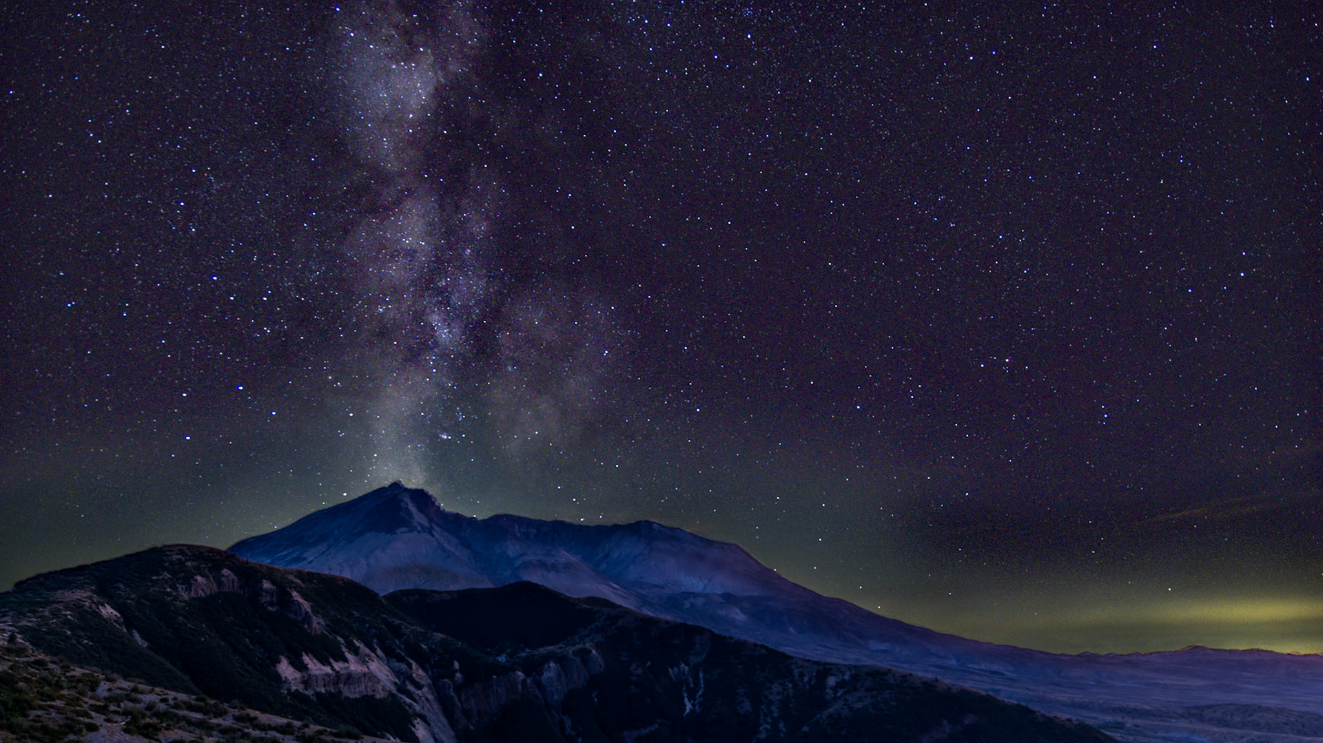 The Milky Way erupts above Mt St Helens on a clear August night.