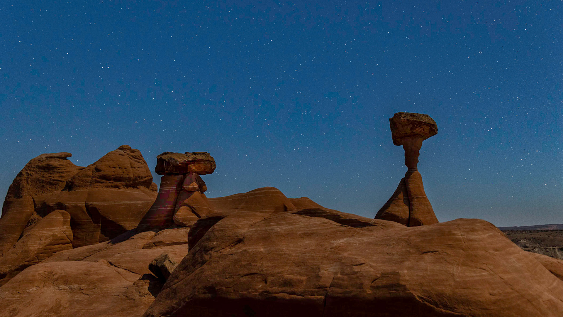 Brilliant clear skys allow the stars to shine bright over the Toadstools, a collection of rock formations east of Kanab, UT along US 89.