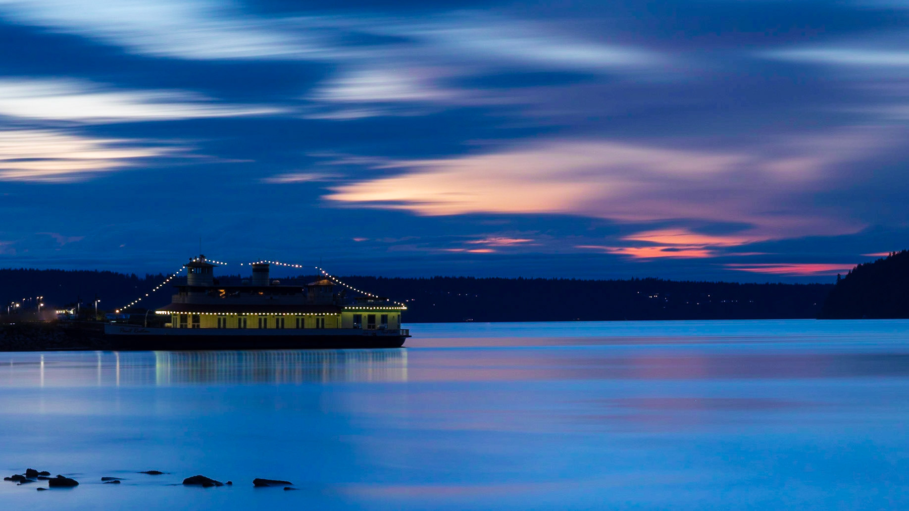 The Point Ruston rides alongside its pier as the sun sets over Commencement Bay