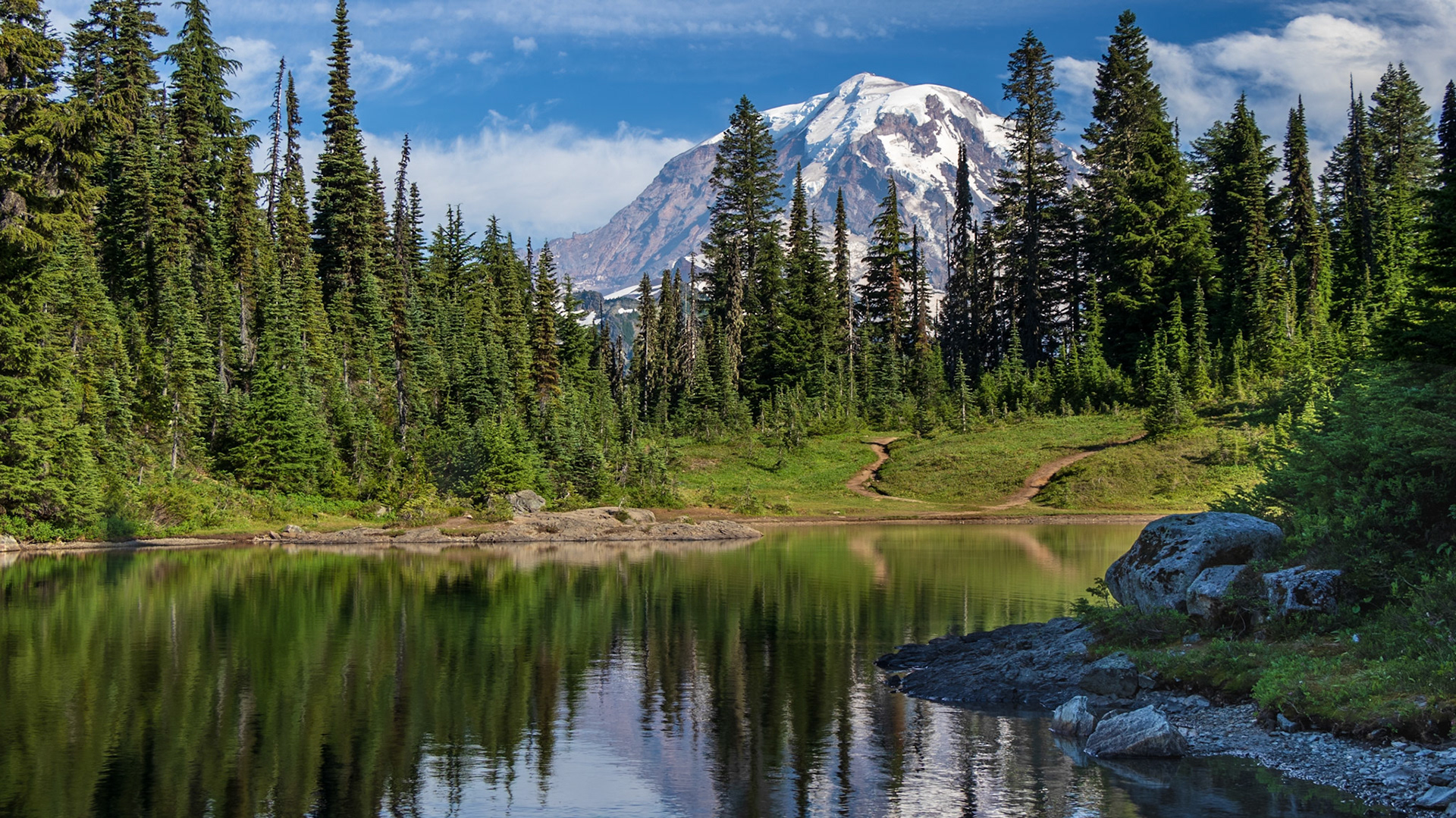 Mt Rainier stands tall above Eunice Lake in the early evening of a bright August day.