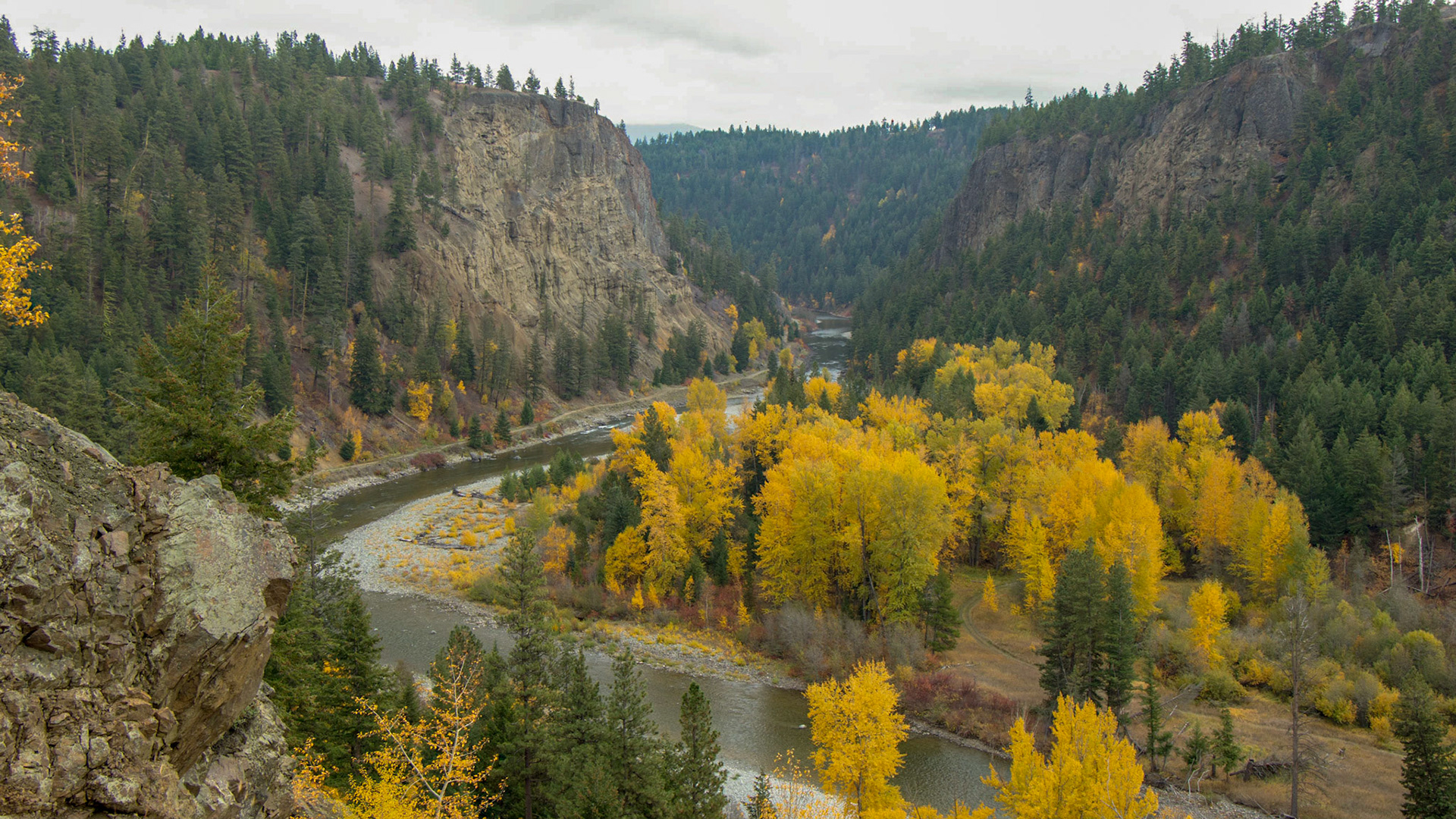 At the bottom of Tulameen Canyon, flows the Tulameen River. The abandoned Kettle Valley Railroad follows the river on one bank, while golden cottonwood and aspen trees line the other side. The old railbed is now a part of the Trans Canada Trail System.