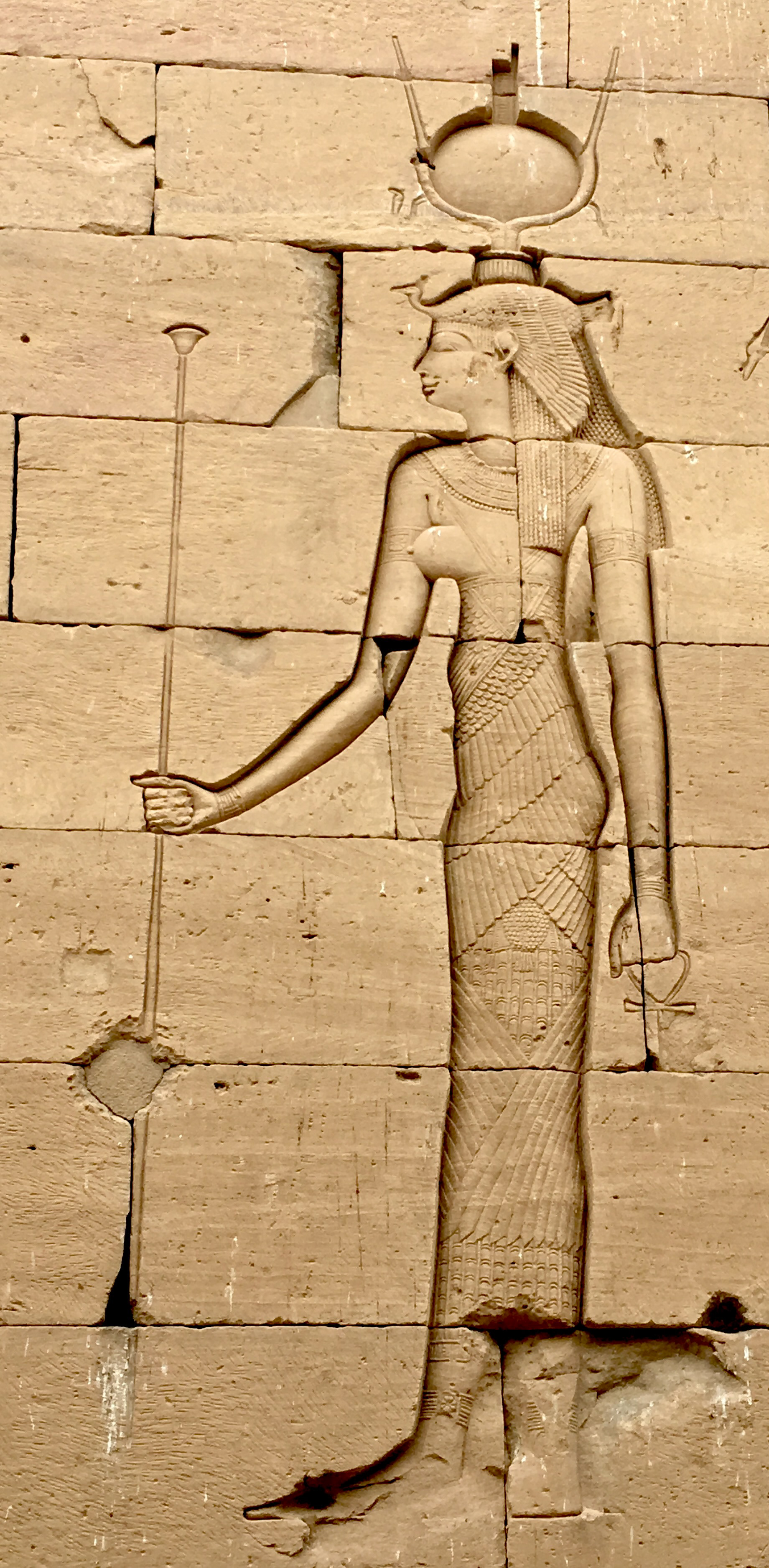 Auset with a crown of both the horns and the throne  on the wall at Temples of Kalabsha, Aswan, Egypt.