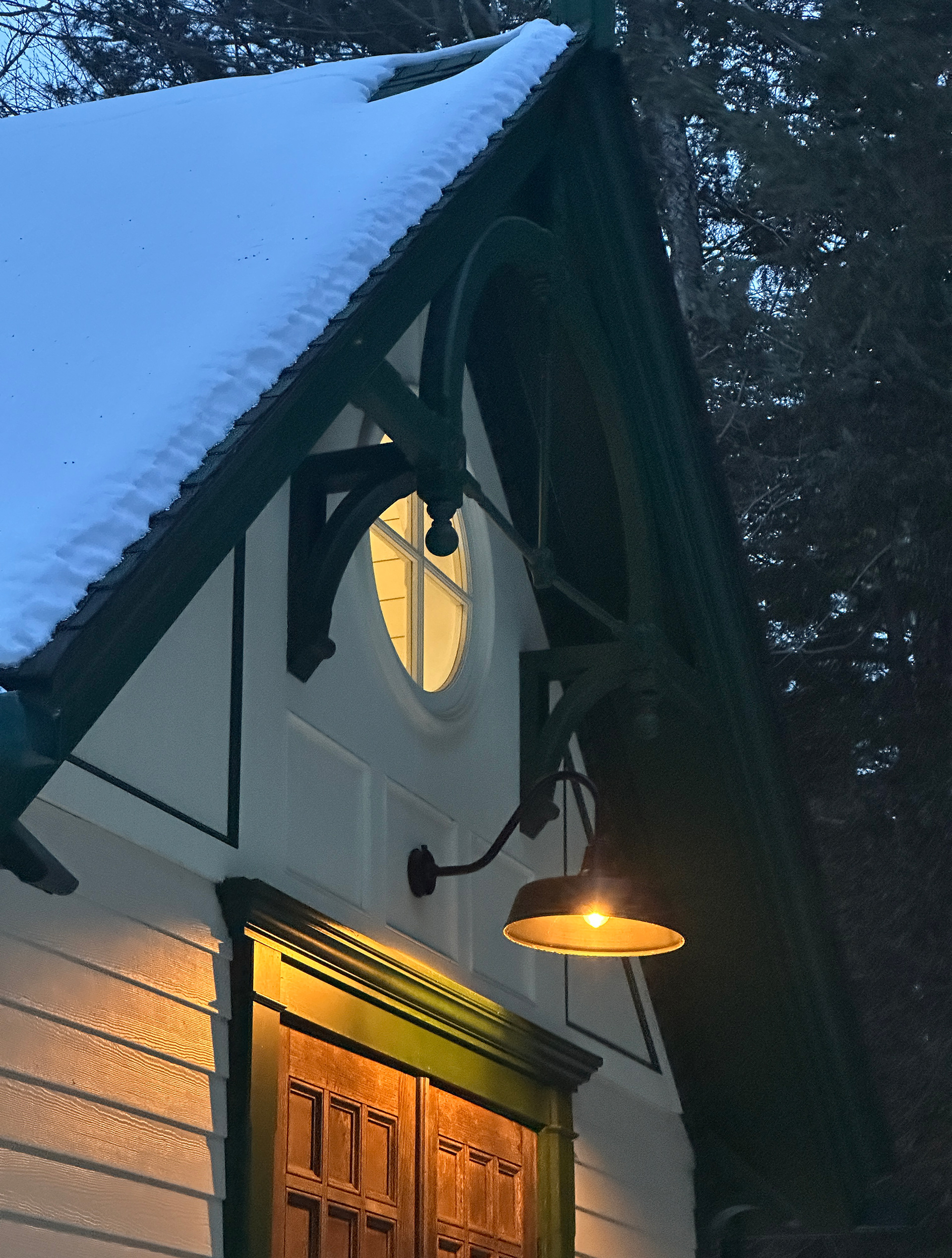 The cottage is well lit with warm lights
