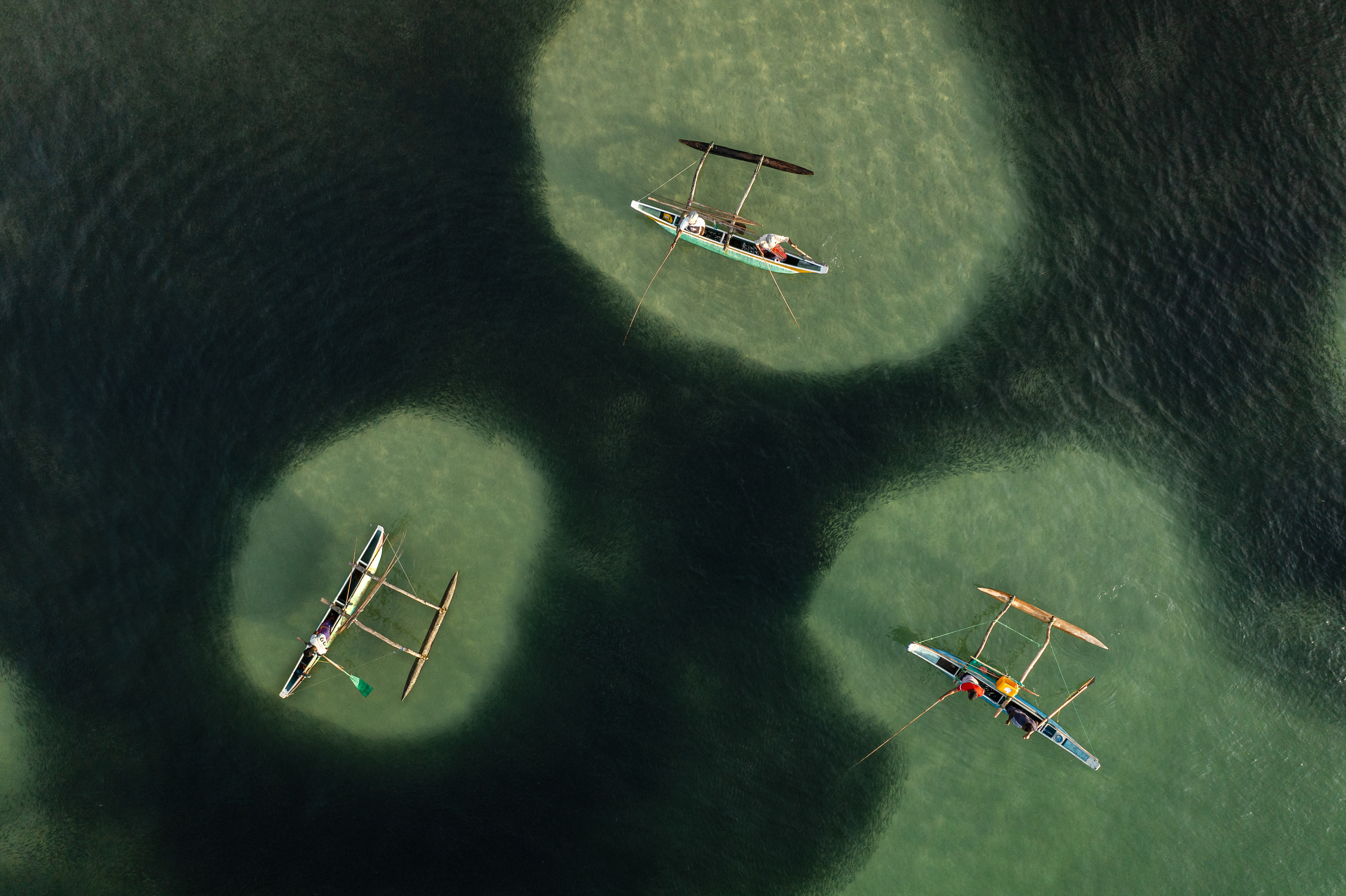Aerial view of boats over shallow water