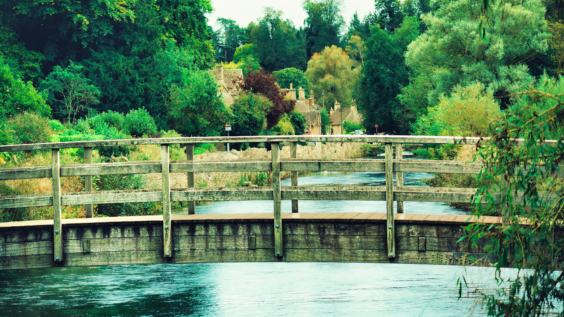 Timeless Crossing – A Wooden Footbridge to a Storybook Village