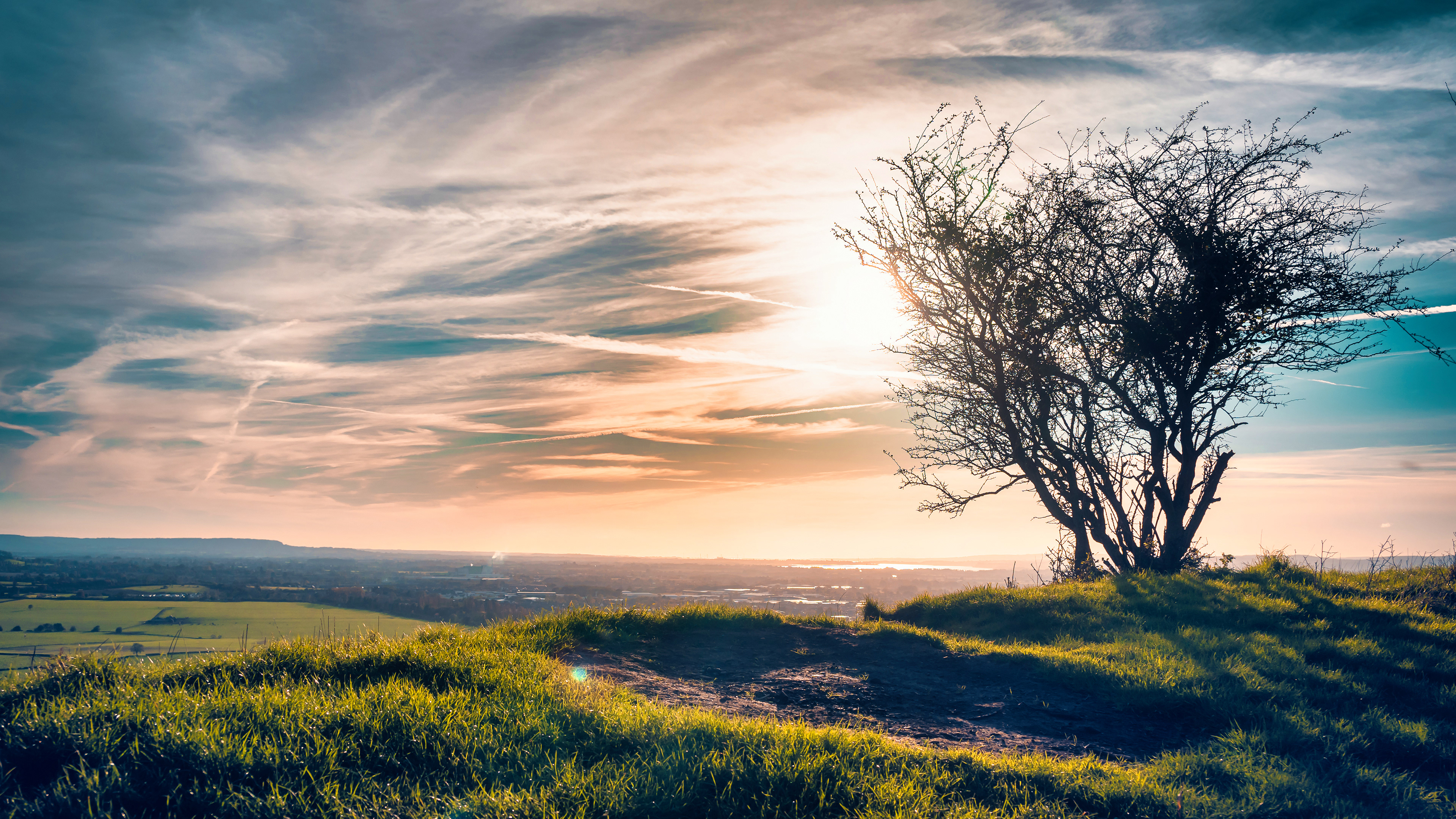 Golden light spills over a quiet hill in Gloucester — a perfect place to pause and take in the view.