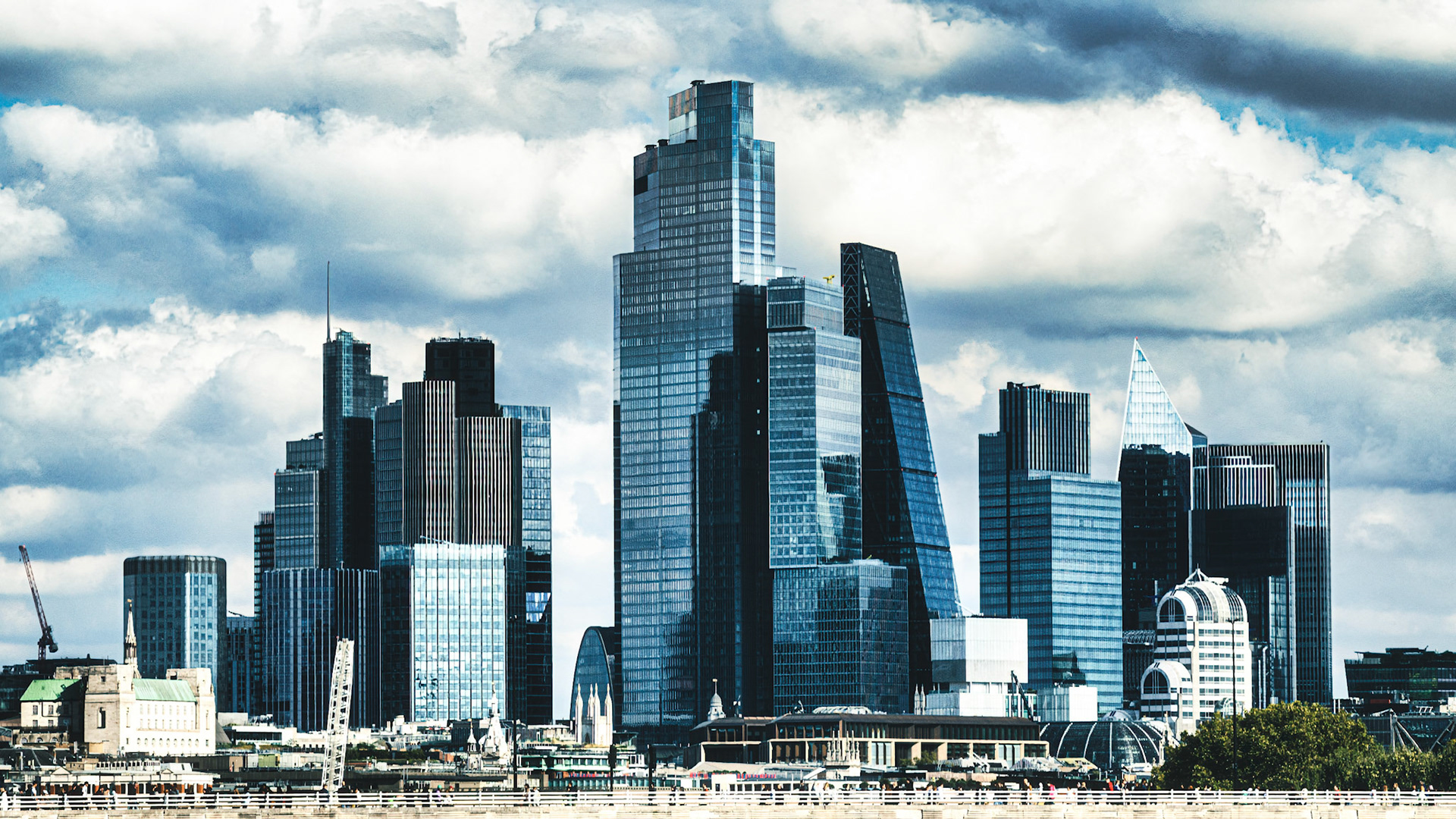 Soaring into the skyline, London’s modern architecture forms a striking silhouette beneath dramatic clouds—where steel, glass, and ambition meet the sky.