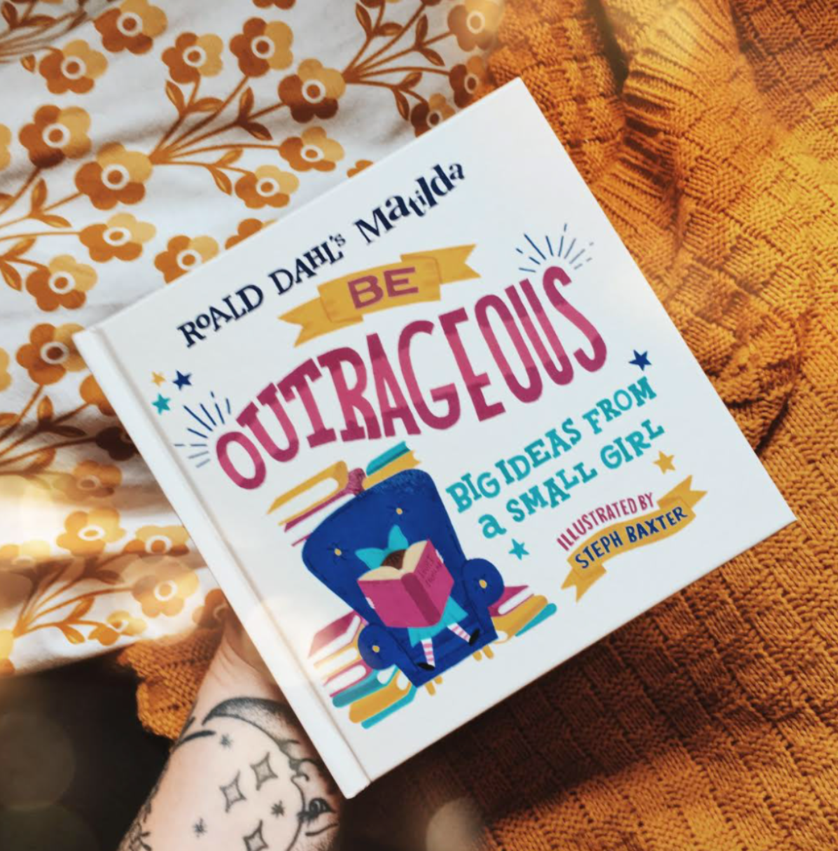 the photo shows a book cover against a yellow background. The book is called "Roald Dahl's Matilda. Be Outrageous. Big Ideas from a Small Girl"