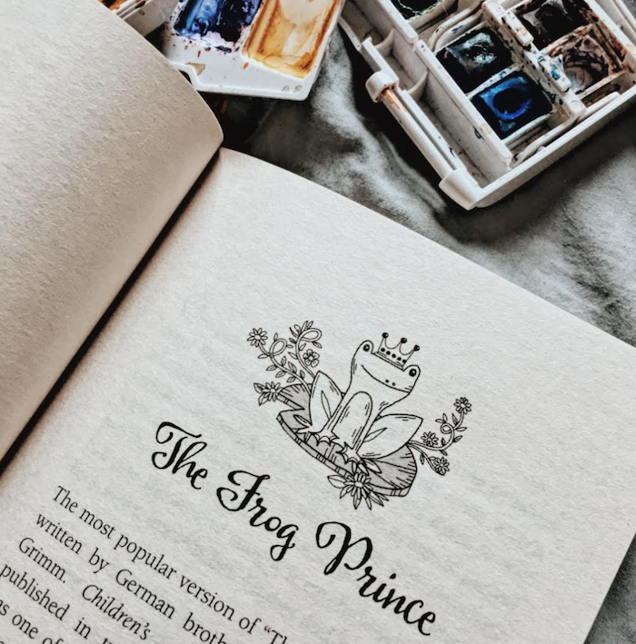 the photo shows a page in a book. The page reads "the frog prince" and has an illustration of a frog wearing a crown sat on a lily pad