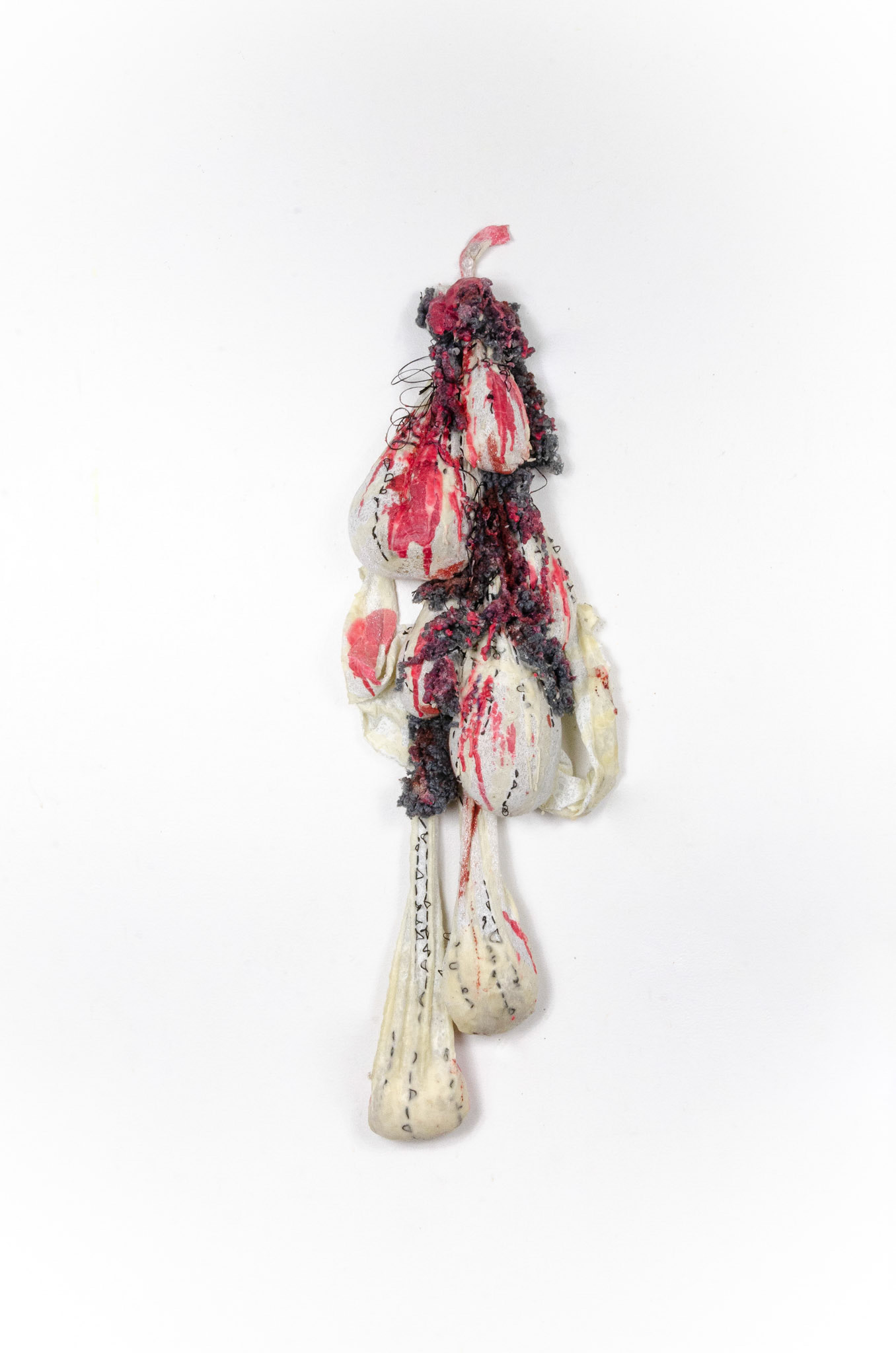 Provocation (2019), 8" x 30". Fabric, Wool, Thread, Red and White Beeswax