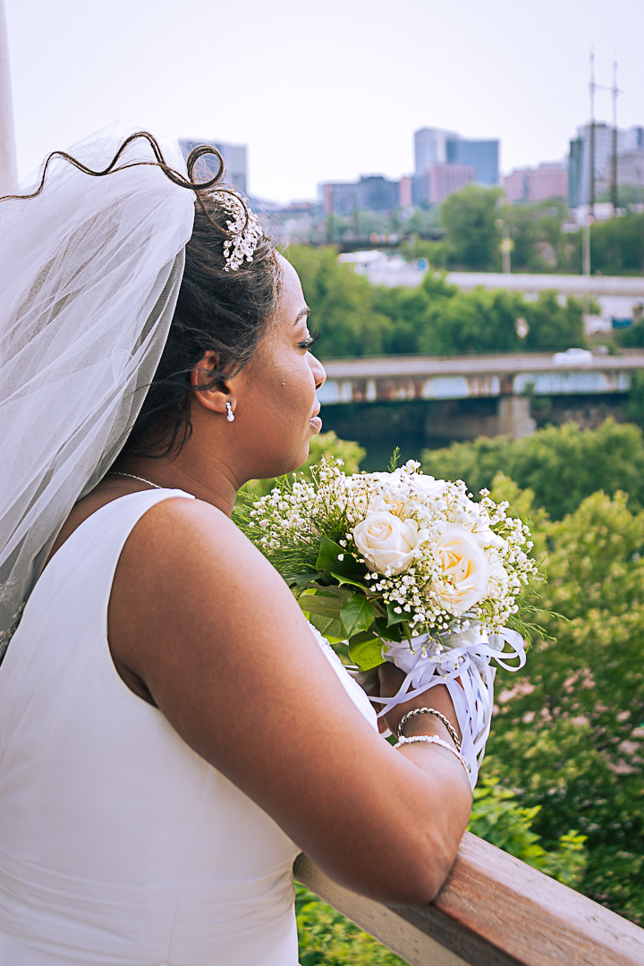 Black African American Bride Looking Out over Philadelphia City Skyline from Philadelphia Art Museum Gazebo