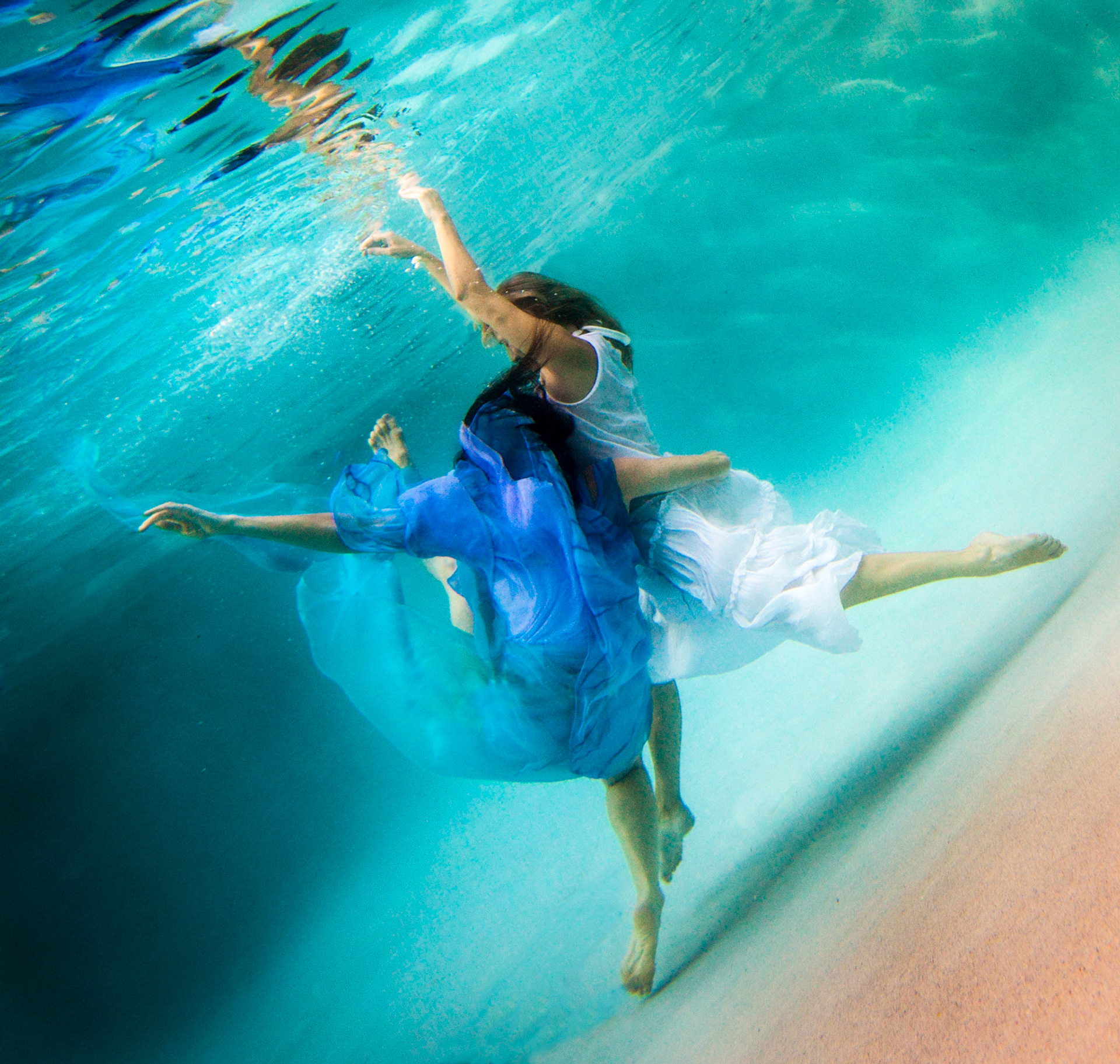 5058-Models demostrating that fashion works underwater as well as above.