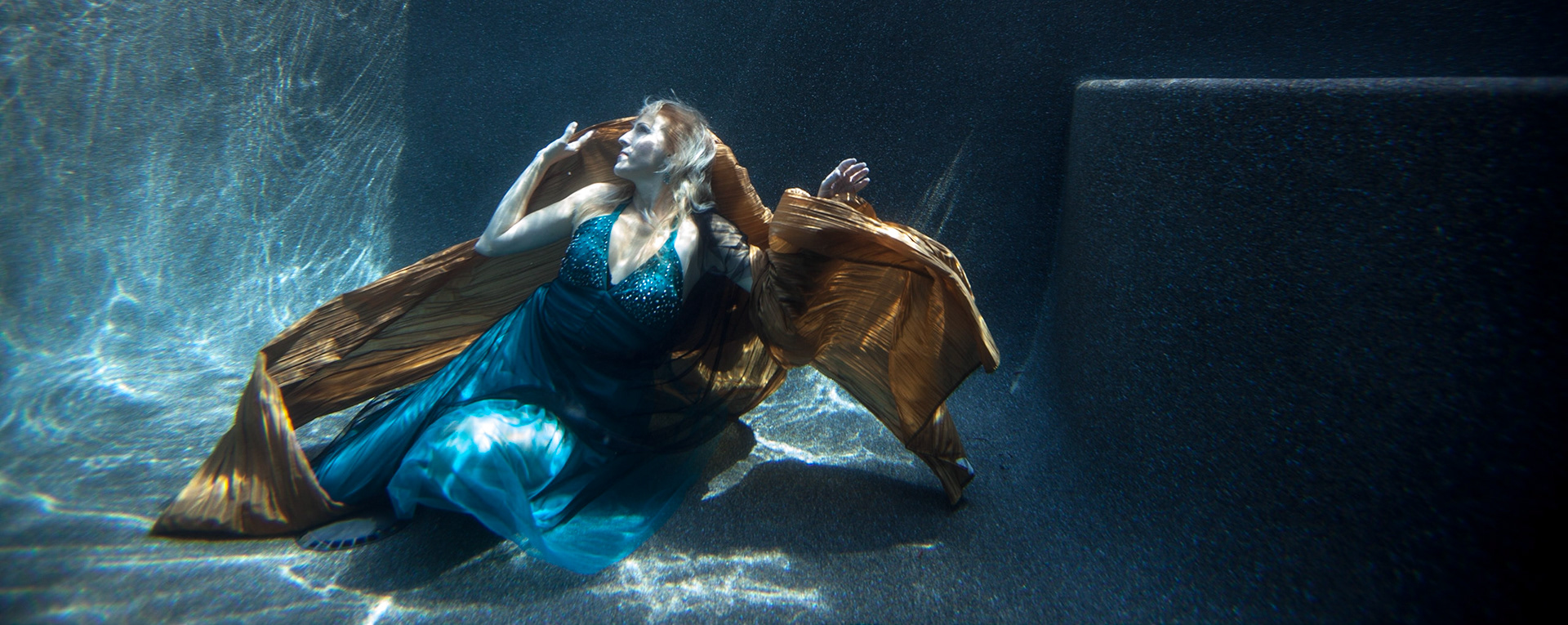5051-Models demostrating that fashion works underwater as well as above.