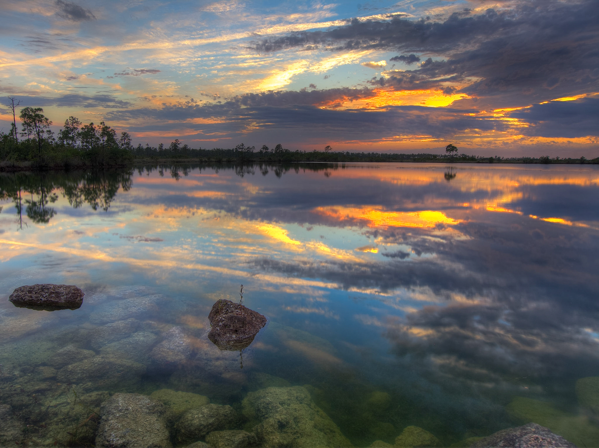 EN2404 -Everglades National Park, the largest subtropical wilderness in the United States, boasts rare and endangered species. It has been designated a World Heritage Site, International Biosphere Reserve, and Wetland of International Importance, significant to all people of the world.