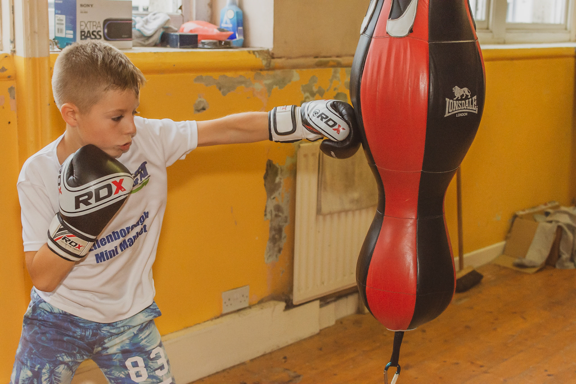 Young boxer boxing training.