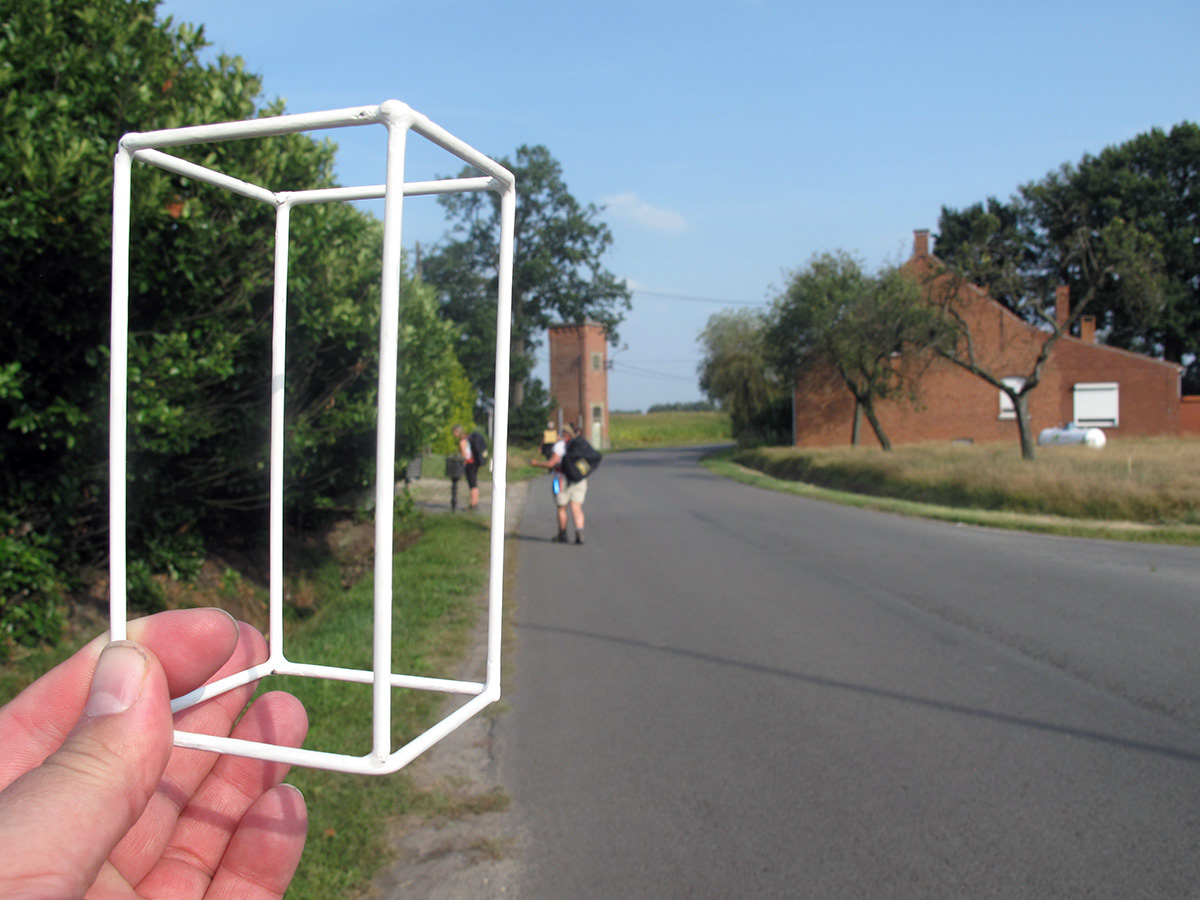 Stephen walking with a wireframe cuboid