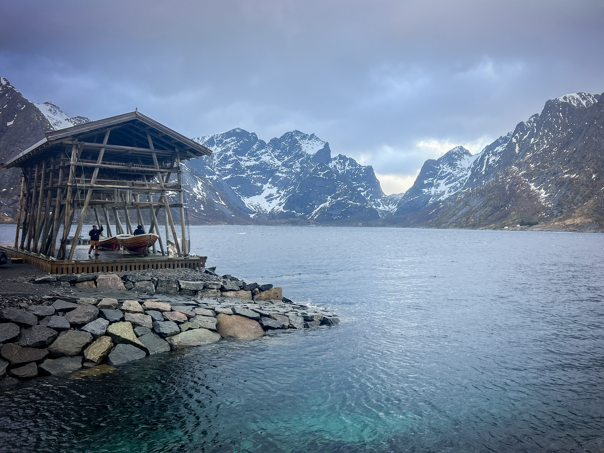 Most fish racks in the Lofoten Islands are simple and open, but this one has a roof to keep the water and birds away. To preserve the fish, they're dried on large racks. There is no need to salt or smoke the fish, as the winter temperatures in Lofoten are just below freezing. While the fish doesn't freeze solid, it also doesn’t rot. Instead, it dries in the sun and wind from late winter until spring. By the end of this process, the fish is completely dry and easy to transport while still retaining its essential nutrients.