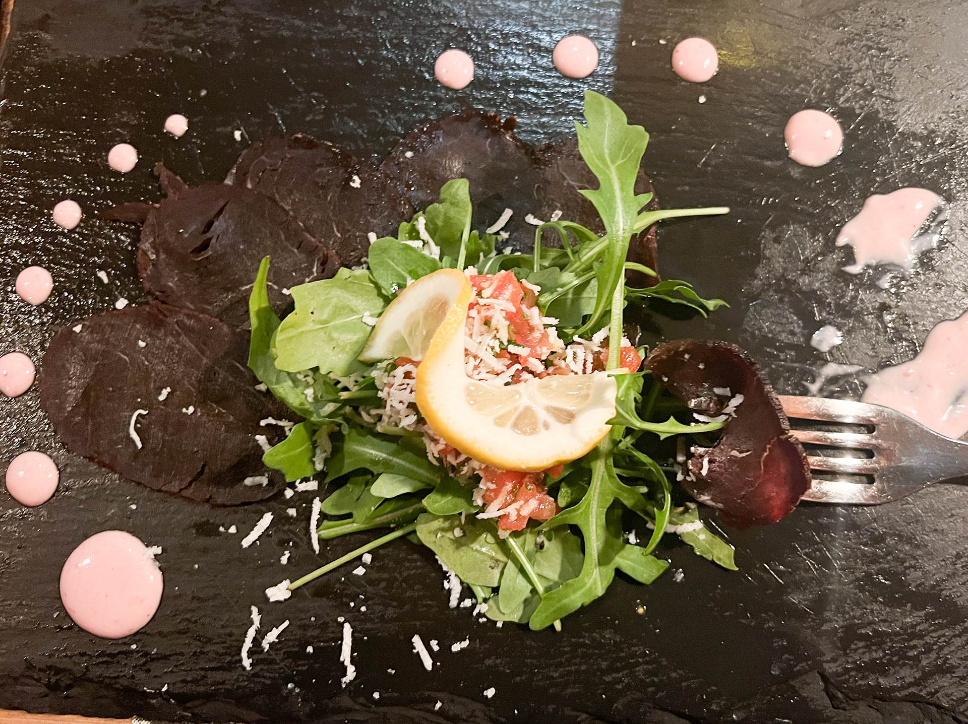 Smoked Whale on a bed of Arugula