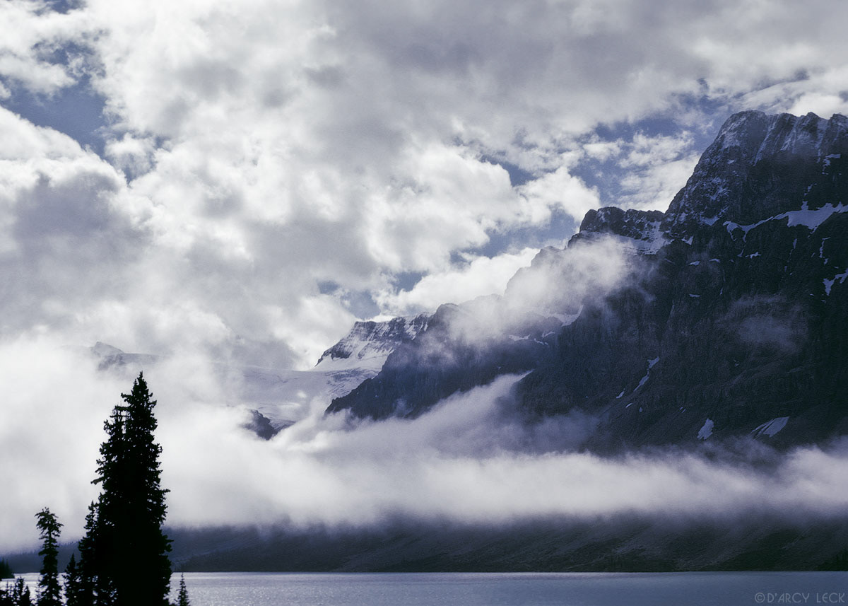 Fog clearing over Bow Lake with Waputik Mountains, Banff National Park, Canada