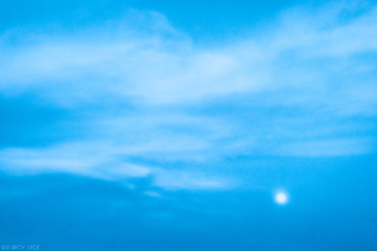 Full moon and cirrus clouds at dusk