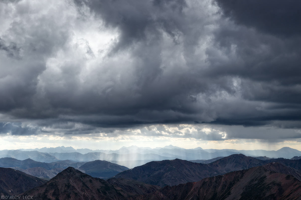 View from summit of Mount Elbert looking Northwest into the Sawatch Range mountains with storm clouds forming, Colorado