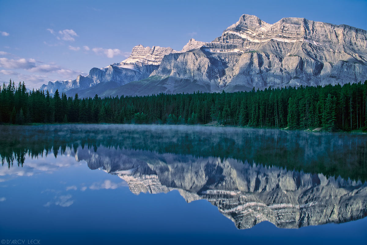 Rundle Mountain reflected in Johnson Lake at sunrise, Banff National Park, Canada