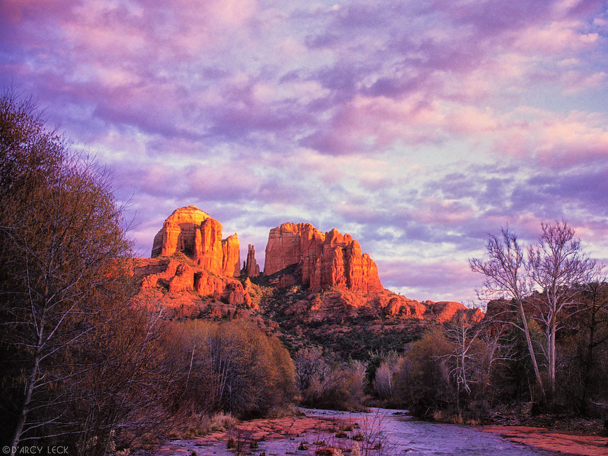 Cathedral Rocks catch the last sunlight at sunset beyond Oak Creek in late Autumn, Arizona