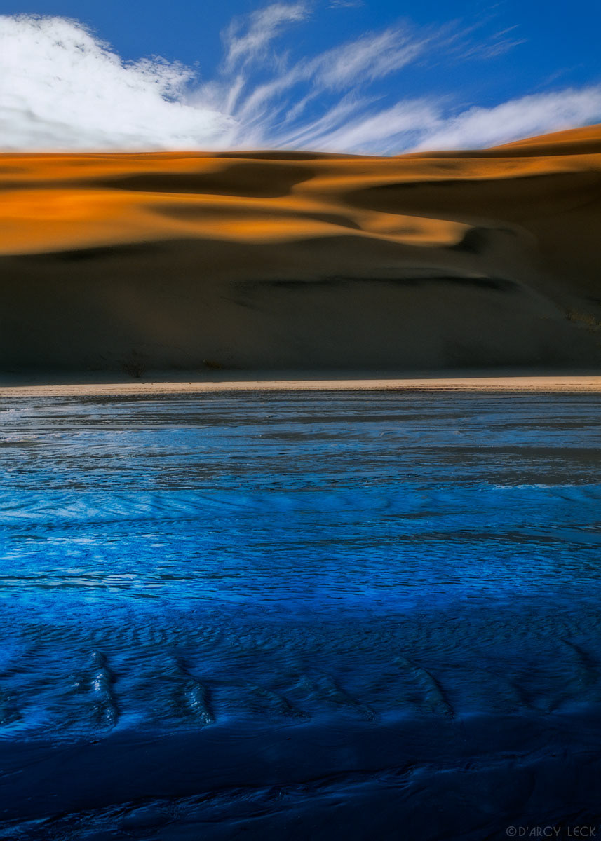 Medano Creek flows past sand dunes, Great Sand Dunes National Park, Colorado, USA