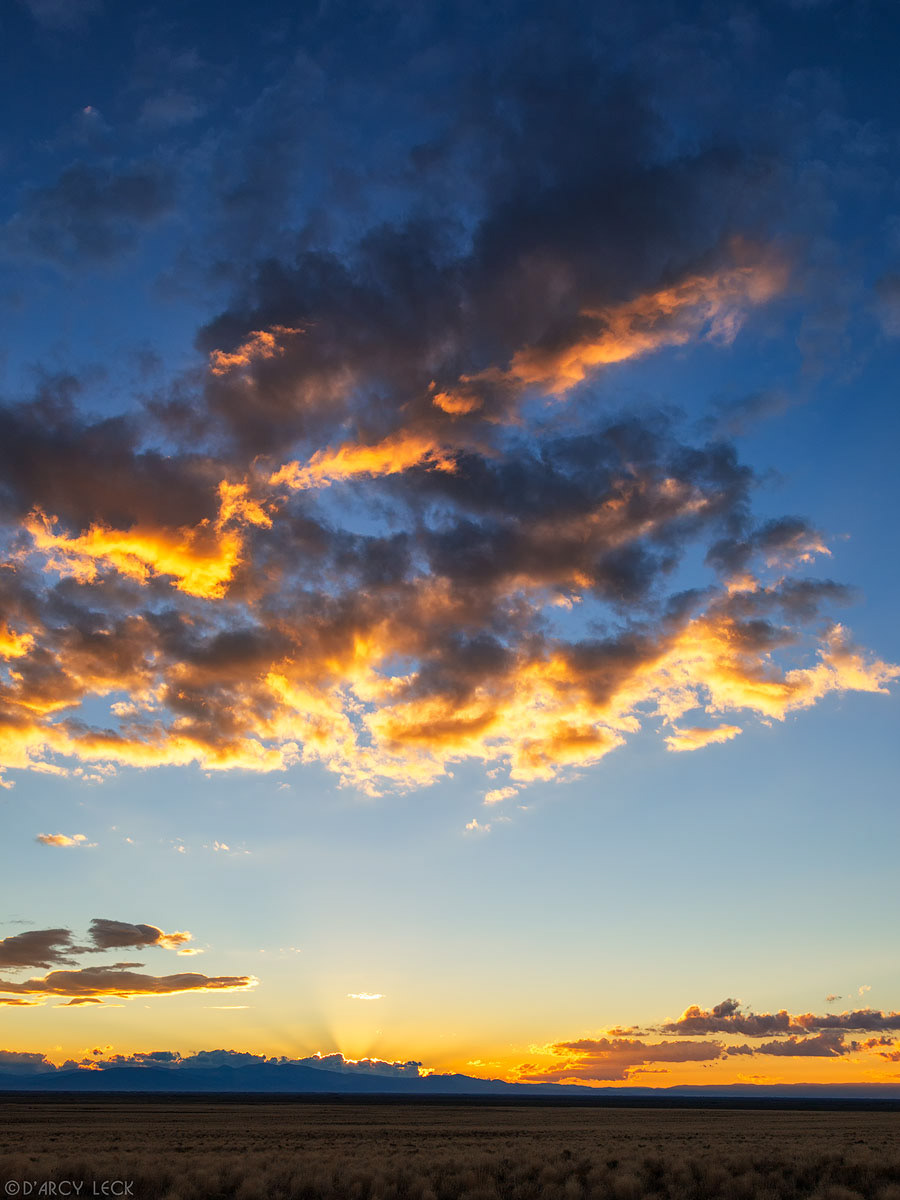 Clouds and sunset over the rangleand of San Luis Valley near Blanca Peak, Colorado