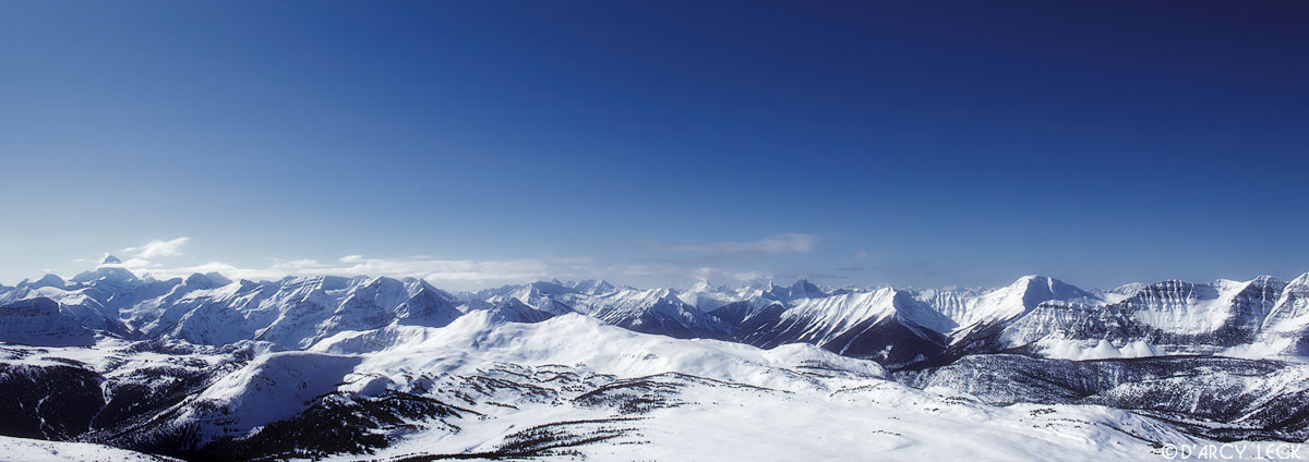 Clear blue Skies and winter snow covers the Rocky Mountains, Canada