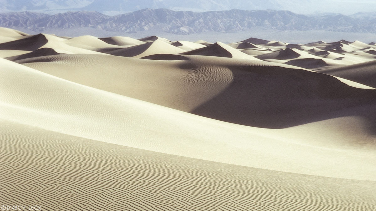 Sand dunes with Panamint mountains in distance, Death Valley National Park, California