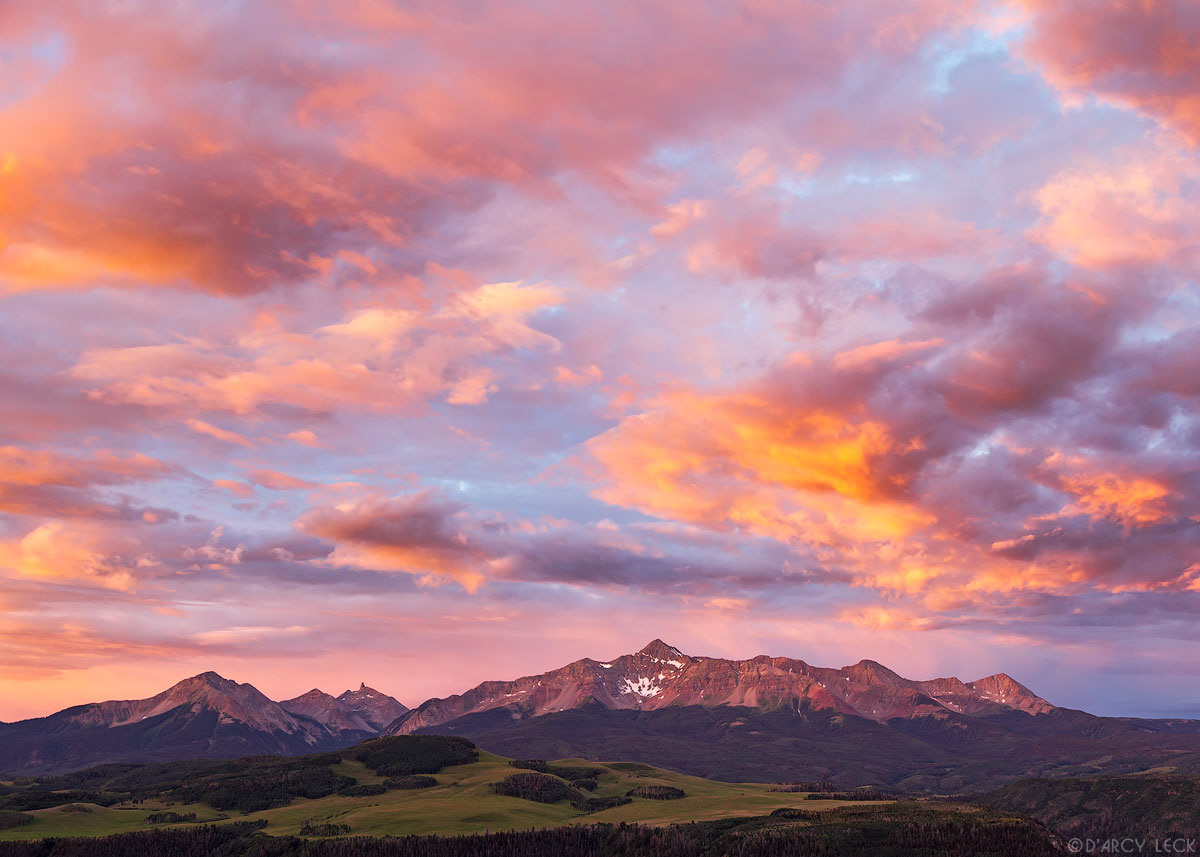 Sunrise colors clouds over Wilson Peak and Wilson Mesa Colorado