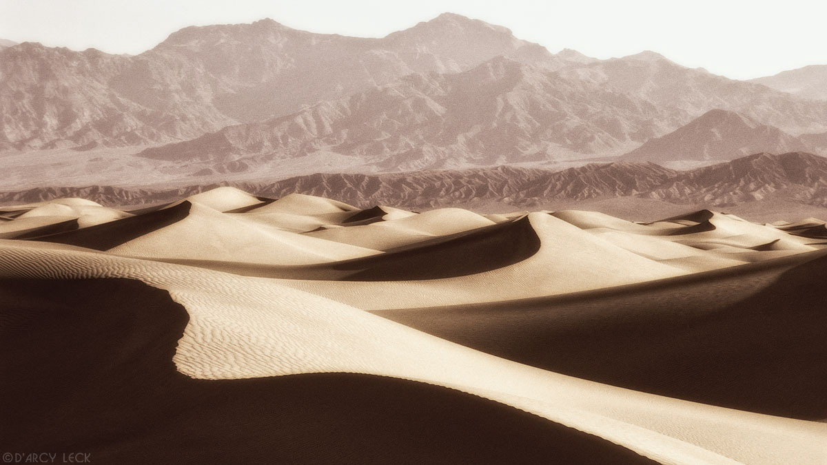Sand dunes with Panamint mountains in distance, Death Valley National Park, California